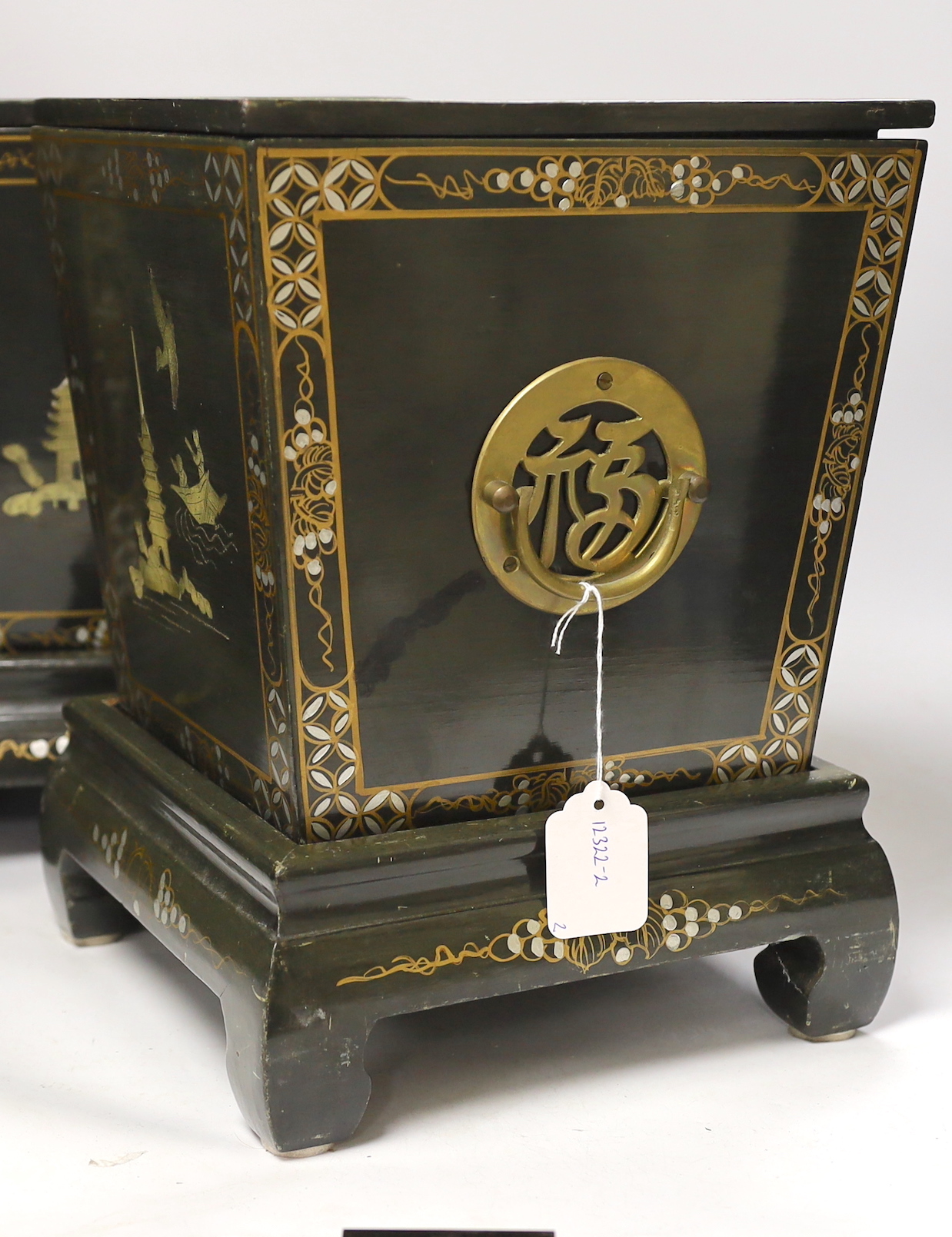 A pair of Chinese lidded lacquer wine coolers and stands, 35cm high